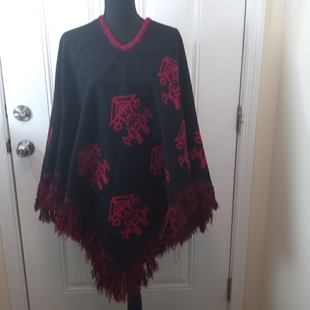 Red and black reversible cape with fringe
